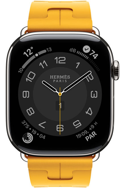 Apple Watch Hermes Series 11, cadran analogique Circulaire (aiguilles pour les heures, les minutes et les secondes, complications : météo, anneaux d’activité, heure de Paris, bruit), boîtier en titane, argent, côté droit, couronne Digital Crown, bracelet Kilim simple tour, jaune (jaune serin), en caoutchouc fluoroélastomère