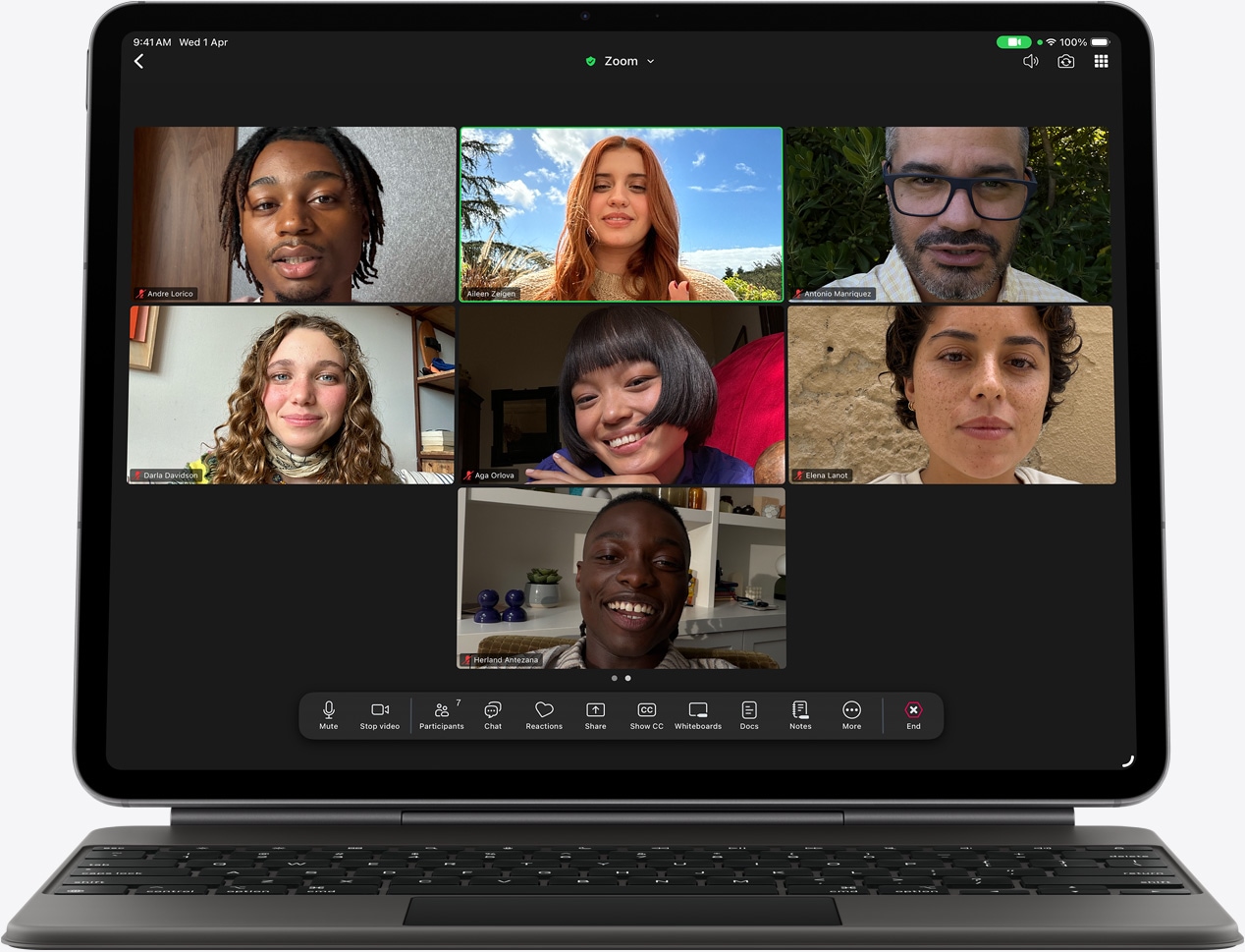 iPad Air, front exterior, Magic Keyboard, black color, FaceTime call on the screen, multiple participants visible