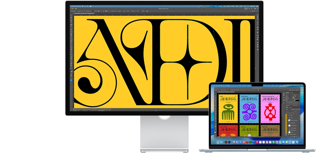 شاشة Studio&nbsp;Display ولابتوب Mac يعرضان مشروعاً قيد الإنجاز في برامج Adobe متعددة، شاشة Studio&nbsp;Display تعرض لقطة مقرّبة لنص أسود على خلفية صفراء فاقعة، وتساعد الطبقة المضادة للانعكاس على تقليل الوهج