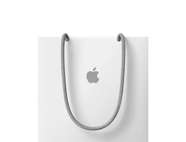 En hvit Apple-handlebag vises med grå håndtak og en grå, midtstilt Apple-logo.